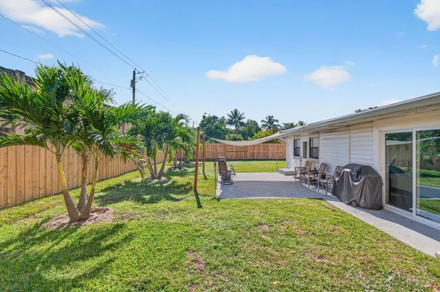 a view of a backyard with a patio