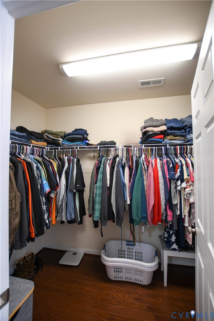 696 Anne Lane Aylett, VA 23009 - Photo 12 of 27 a walk in closet with clothes and shoes