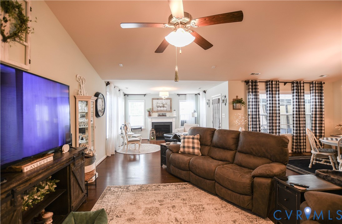 696 Anne Lane Aylett, VA 23009 - Photo 14 of 27 a living room with furniture wooden floor and chandelier