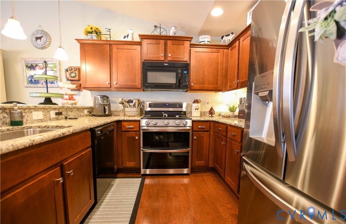696 Anne Lane Aylett, VA 23009 - Photo 18 of 27 a kitchen with stainless steel appliances a refrigerator sink and stove