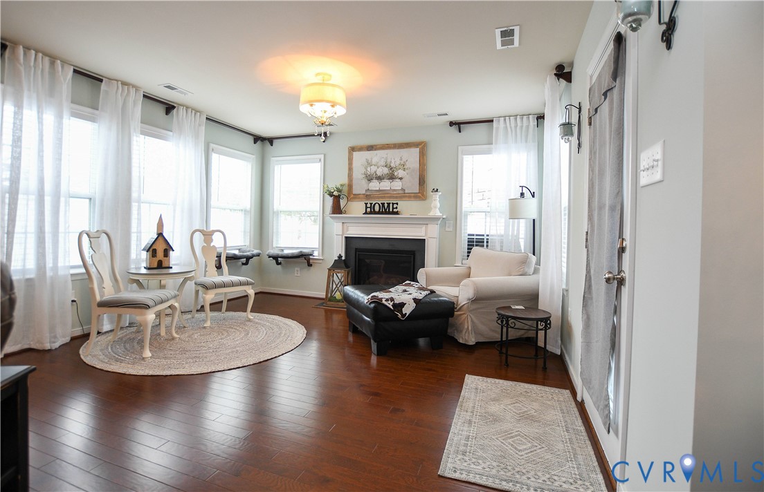 696 Anne Lane Aylett, VA 23009 - Photo 2 of 27 a living room with furniture wooden floor and a fireplace
