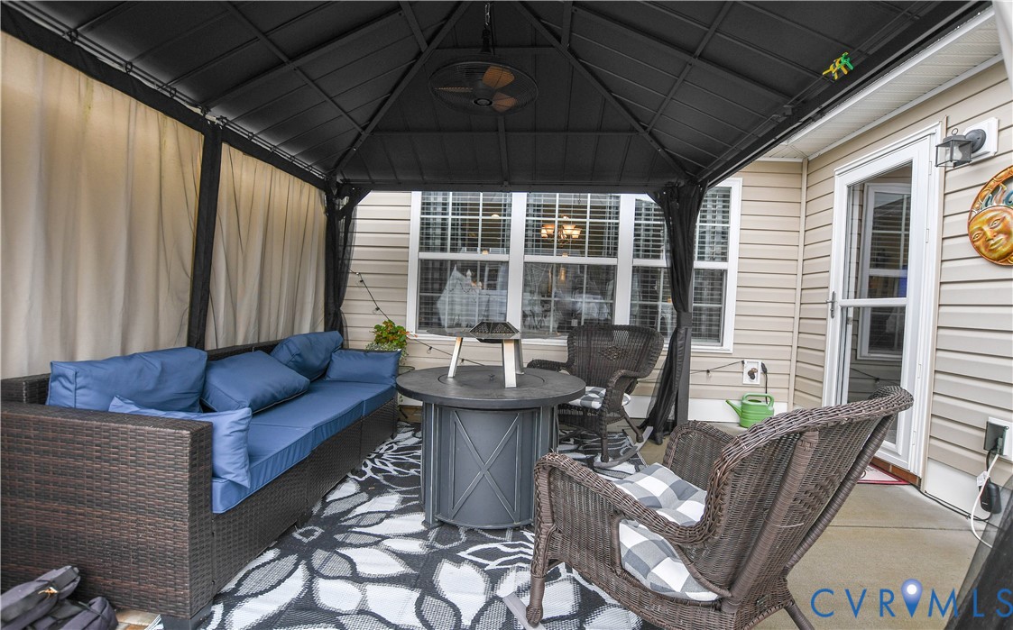 696 Anne Lane Aylett, VA 23009 - Photo 22 of 27 a outdoor living space with furniture and a potted plant