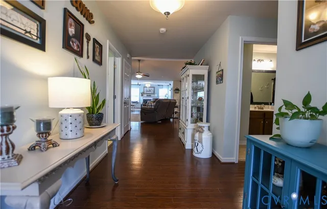 a view of living room with furniture and wooden floor