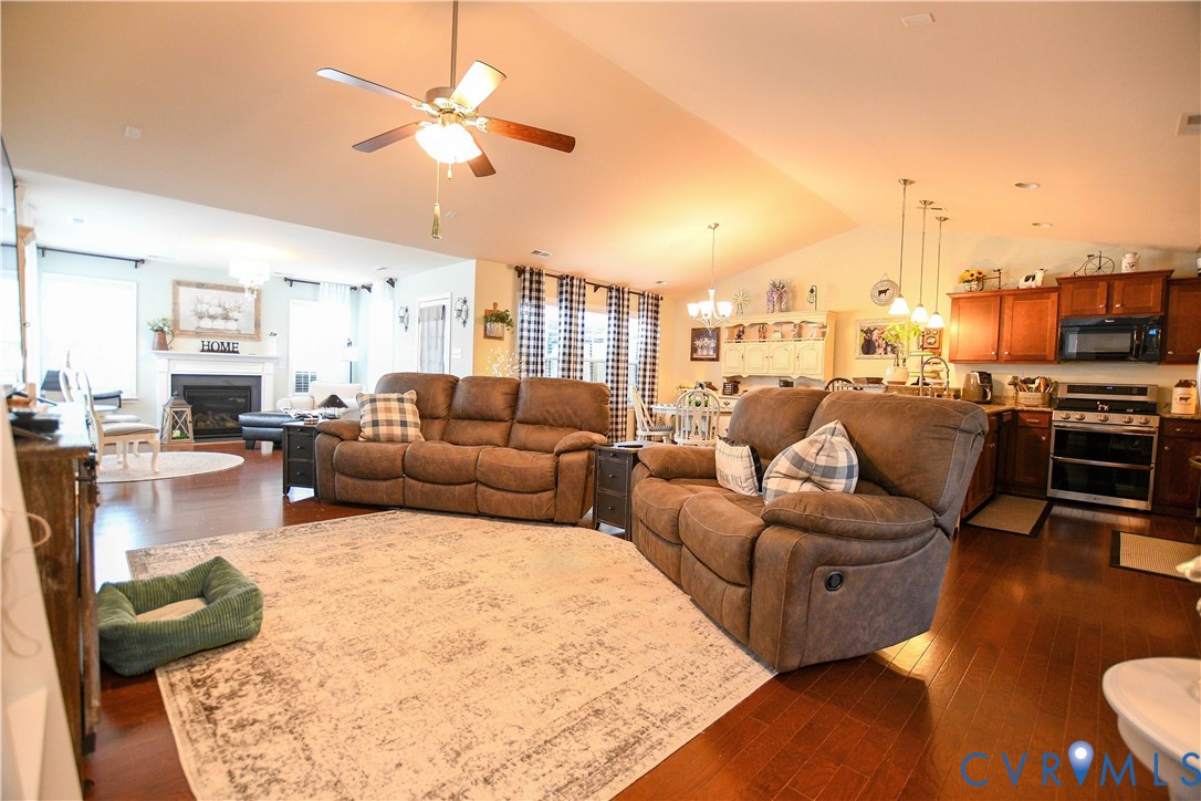 696 Anne Lane Aylett, VA 23009 - Photo 7 of 27 a living room with furniture kitchen view and a chandelier