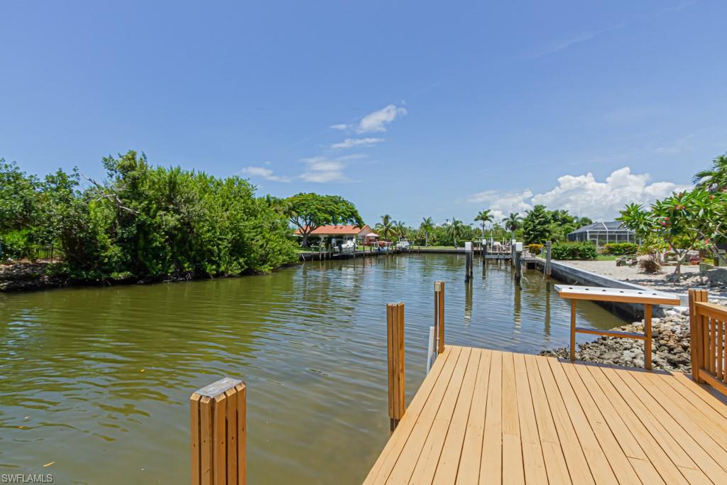 410 Panay Avenue Naples, FL 34113 - Photo 1 of 34 a lake view with a lake view