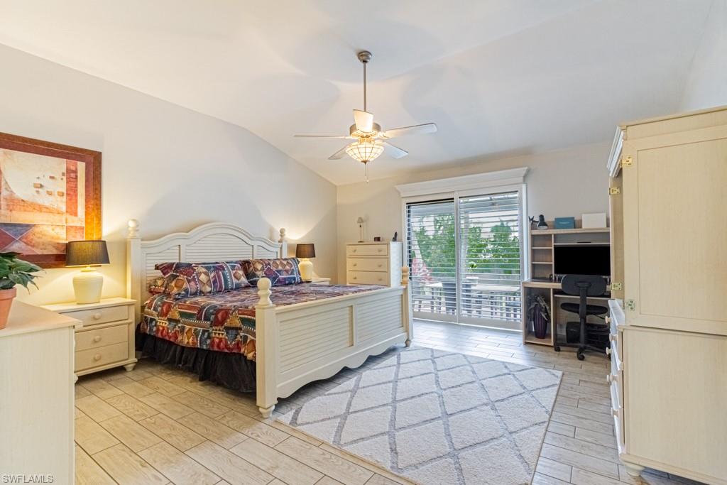410 Panay Avenue Naples, FL 34113 - Photo 15 of 34 a living room with a bed furniture and a flat screen tv