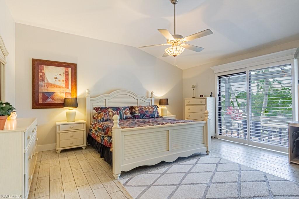 410 Panay Avenue Naples, FL 34113 - Photo 16 of 34 a kitchen with stainless steel appliances a stove a chimney a sink and cabinets
