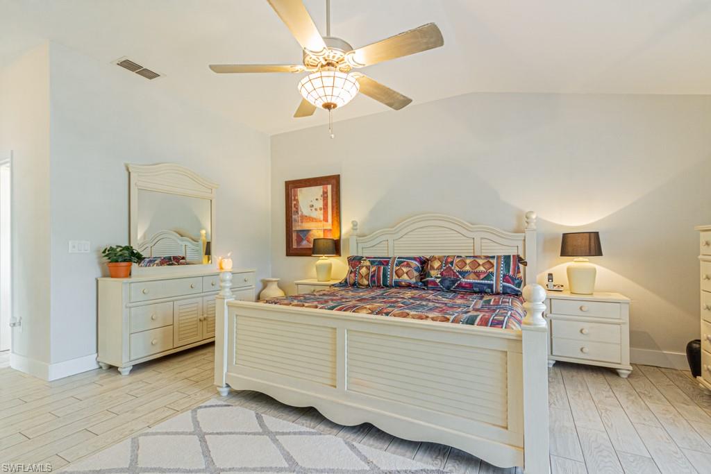 410 Panay Avenue Naples, FL 34113 - Photo 17 of 34 a bed room with a bed and a baby crib