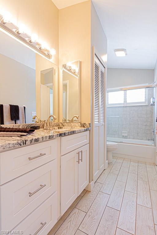 410 Panay Avenue Naples, FL 34113 - Photo 21 of 34 a bathroom with a granite countertop sink and a mirror