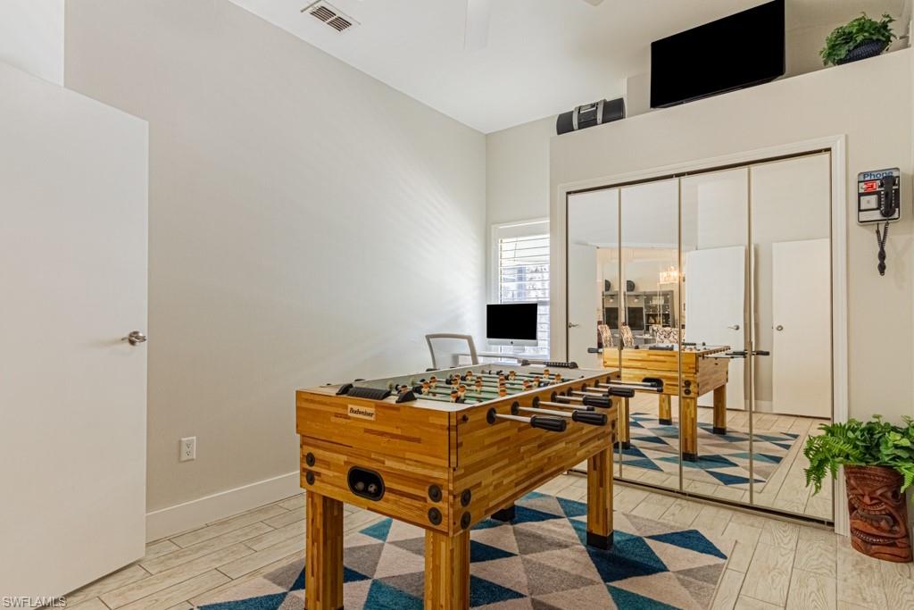 410 Panay Avenue Naples, FL 34113 - Photo 25 of 34 a view of a workspace with furniture