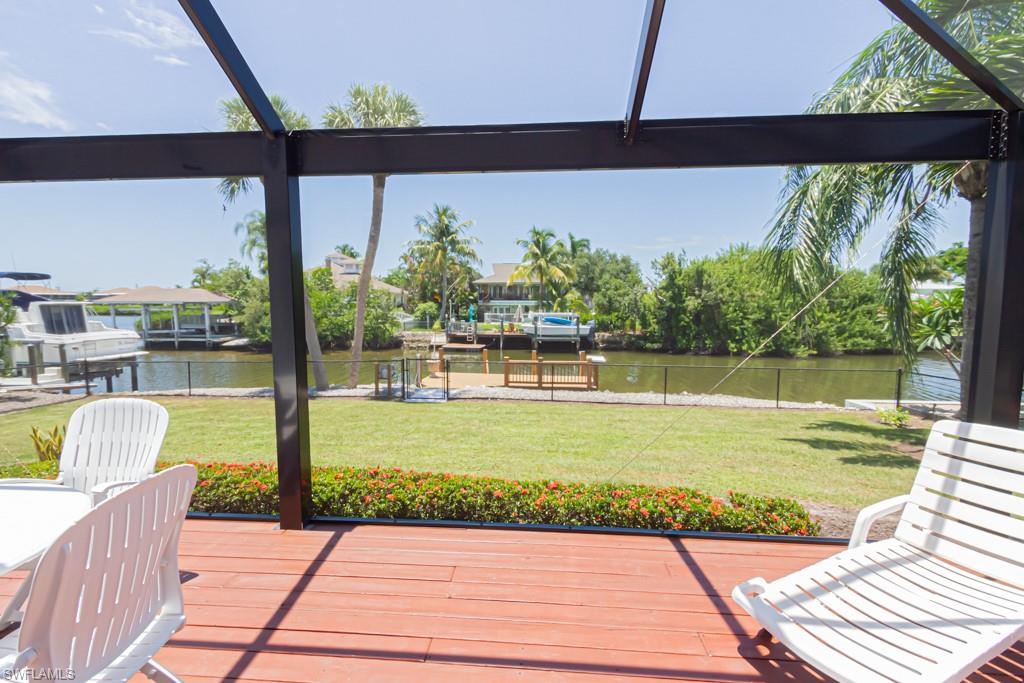 410 Panay Avenue Naples, FL 34113 - Photo 27 of 34 a view of a swimming pool with a patio