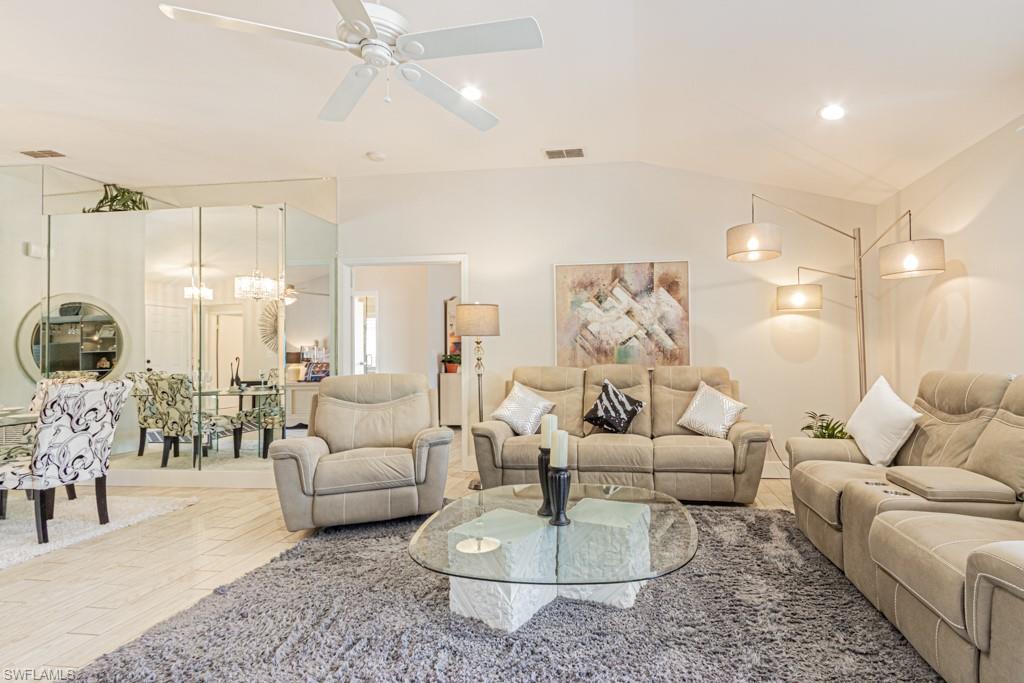 410 Panay Avenue Naples, FL 34113 - Photo 4 of 34 a living room with furniture and a large window