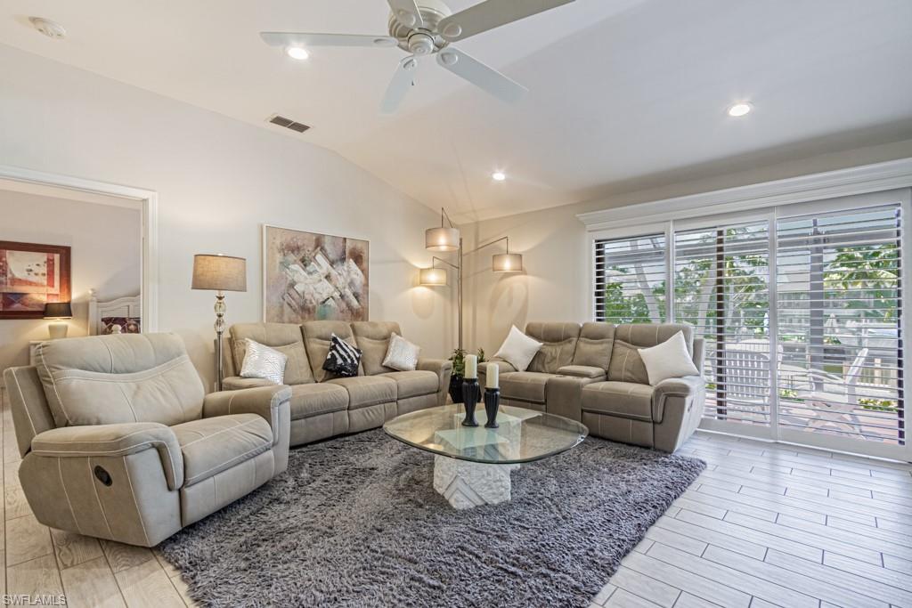 410 Panay Avenue Naples, FL 34113 - Photo 9 of 34 a living room with furniture and a large window