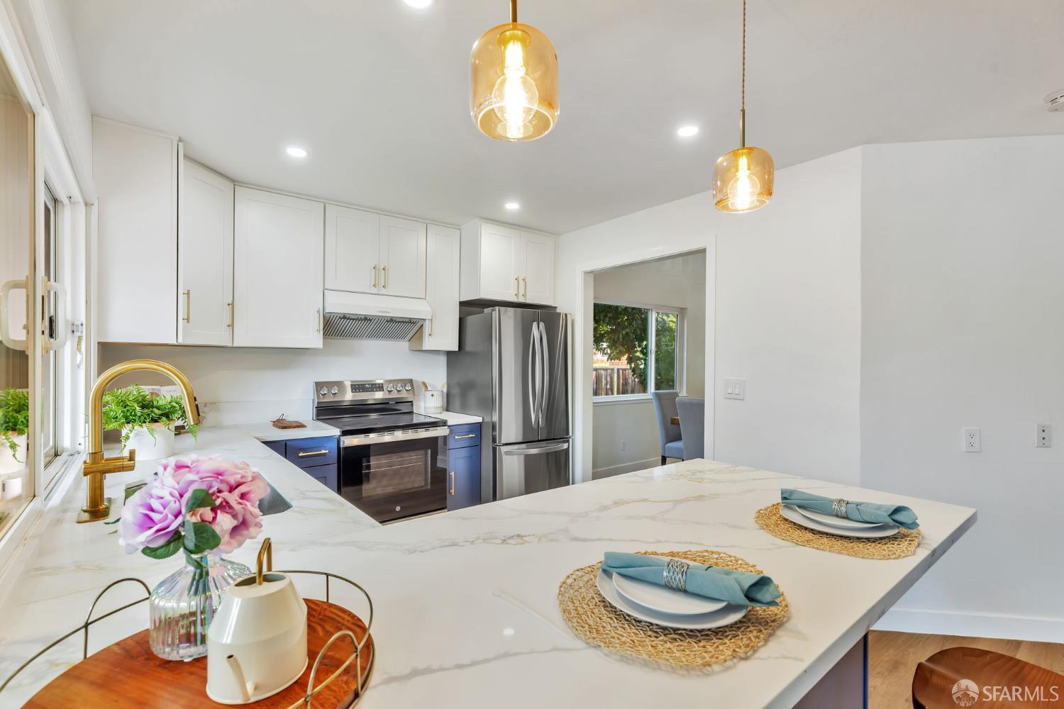1467 Hudson Way Livermore, CA 94550 - Photo 11 of 48 a kitchen with stainless steel appliances granite countertop a sink dishwasher and white cabinets with wooden floor