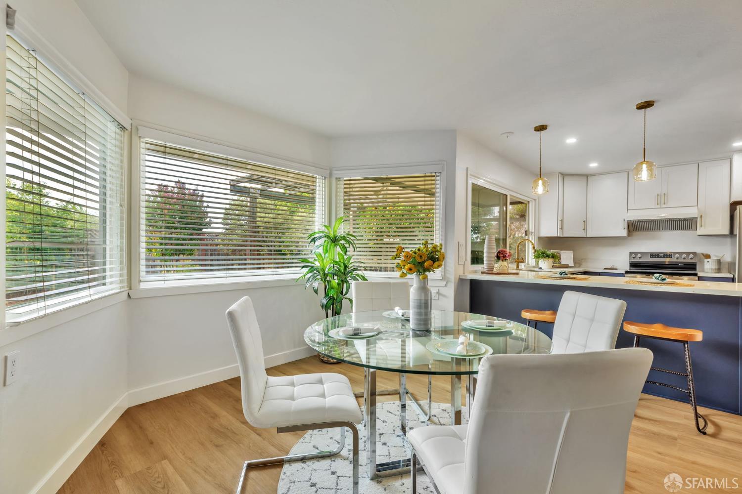 1467 Hudson Way Livermore, CA 94550 - Photo 14 of 48 a dining room with furniture a window and kitchen view