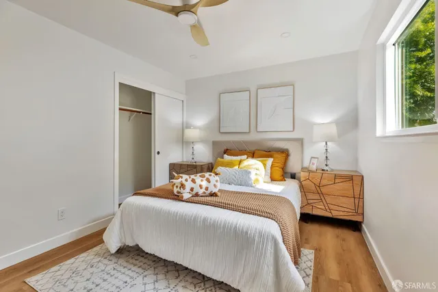 a bedroom with a bed and a couch