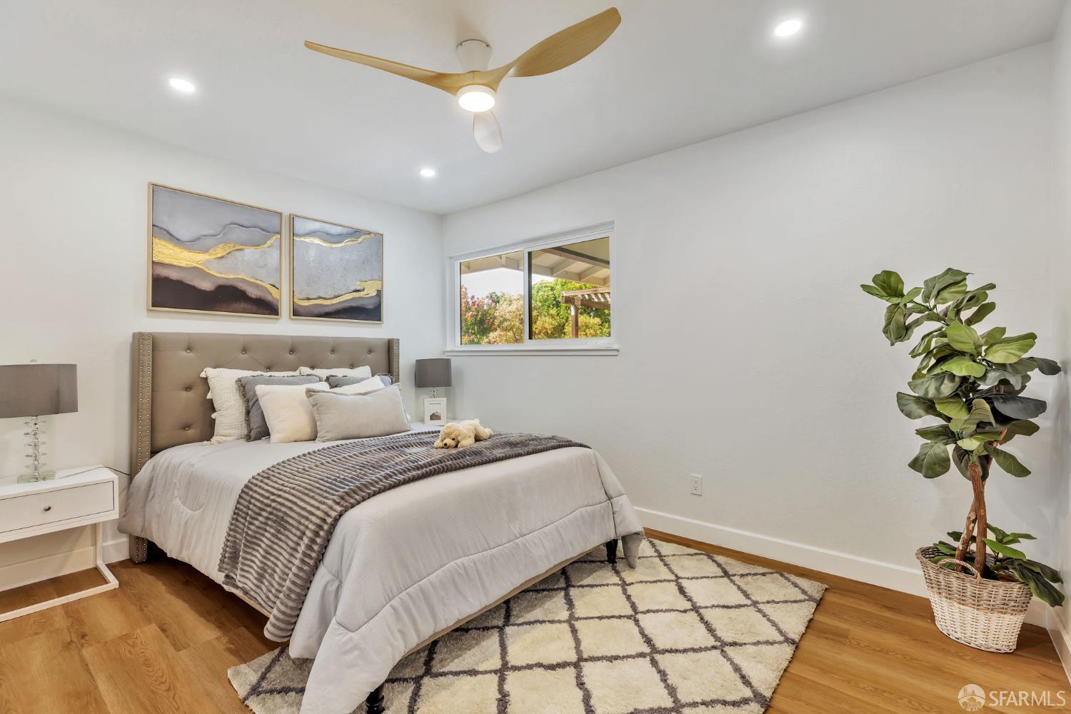 1467 Hudson Way Livermore, CA 94550 - Photo 21 of 48 a bedroom with a bed and a potted plant