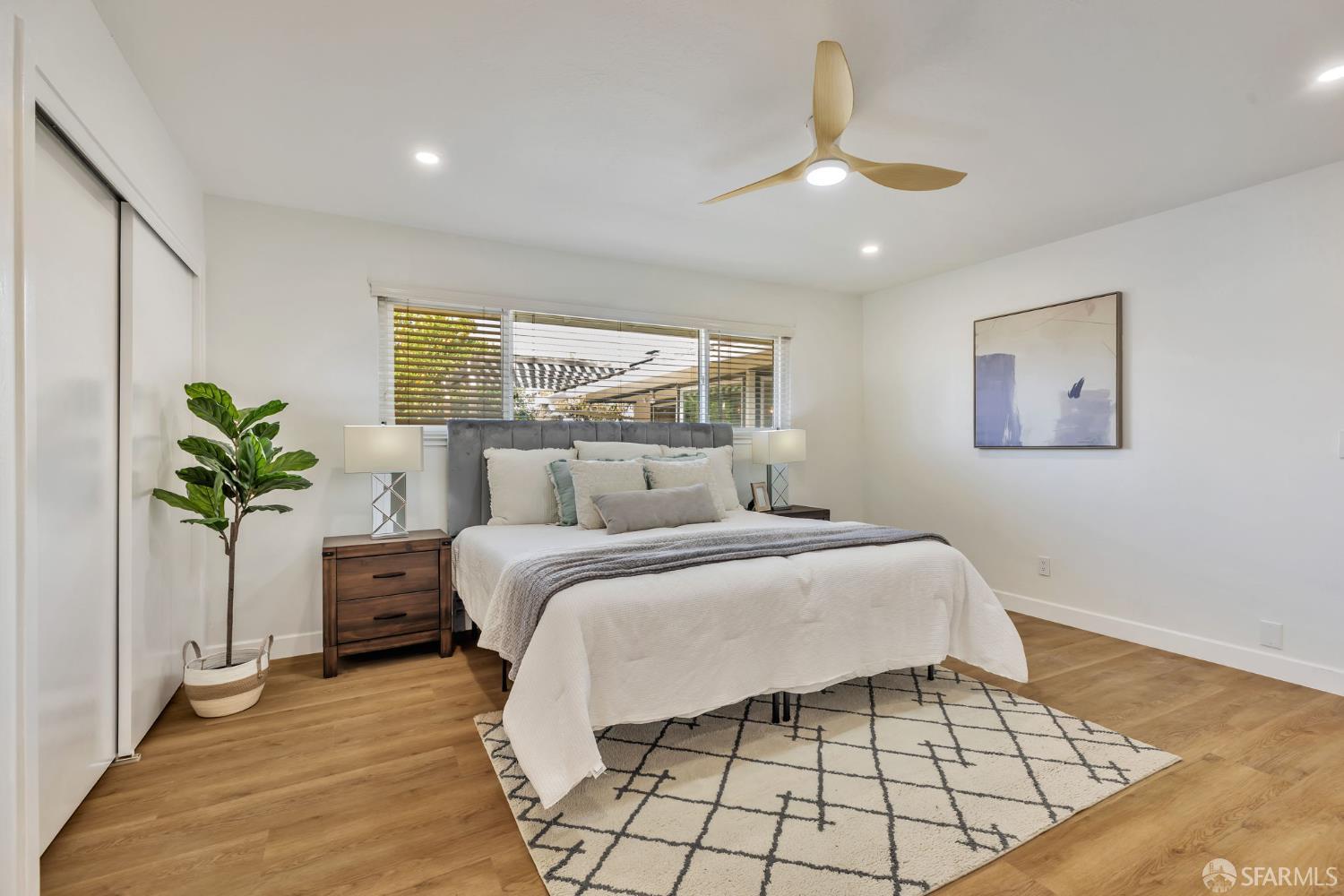 1467 Hudson Way Livermore, CA 94550 - Photo 26 of 48 a bedroom with a bed and a potted plant