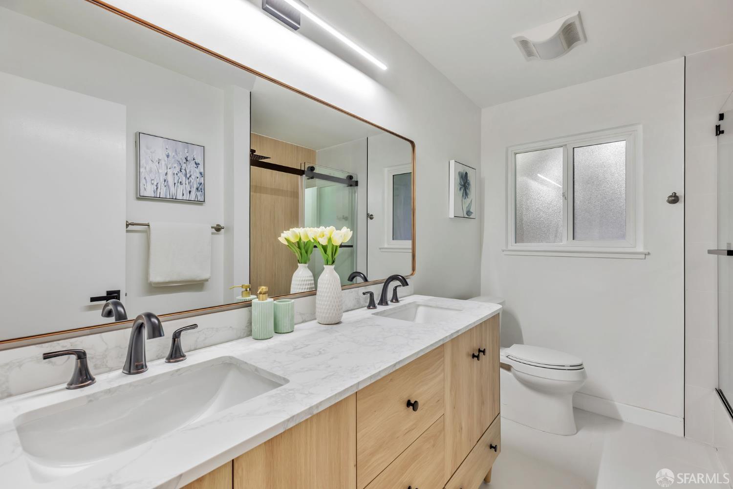 1467 Hudson Way Livermore, CA 94550 - Photo 31 of 48 a bathroom with a double vanity sink and a mirror
