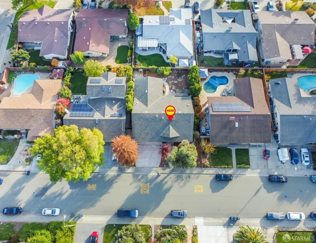 an aerial view of a house with a swimming pool