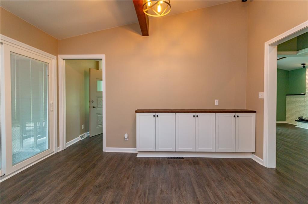 681 Bullcreek Road Butler, PA 16002 - Photo 11 of 39 a view of an empty room with wooden floor and a window