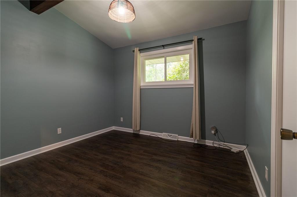 681 Bullcreek Road Butler, PA 16002 - Photo 15 of 39 an empty room with wooden floor and windows
