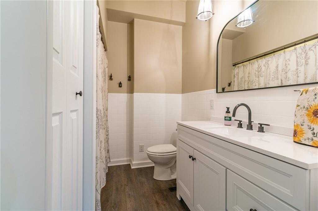 681 Bullcreek Road Butler, PA 16002 - Photo 18 of 39 a bathroom with a sink a toilet and a mirror