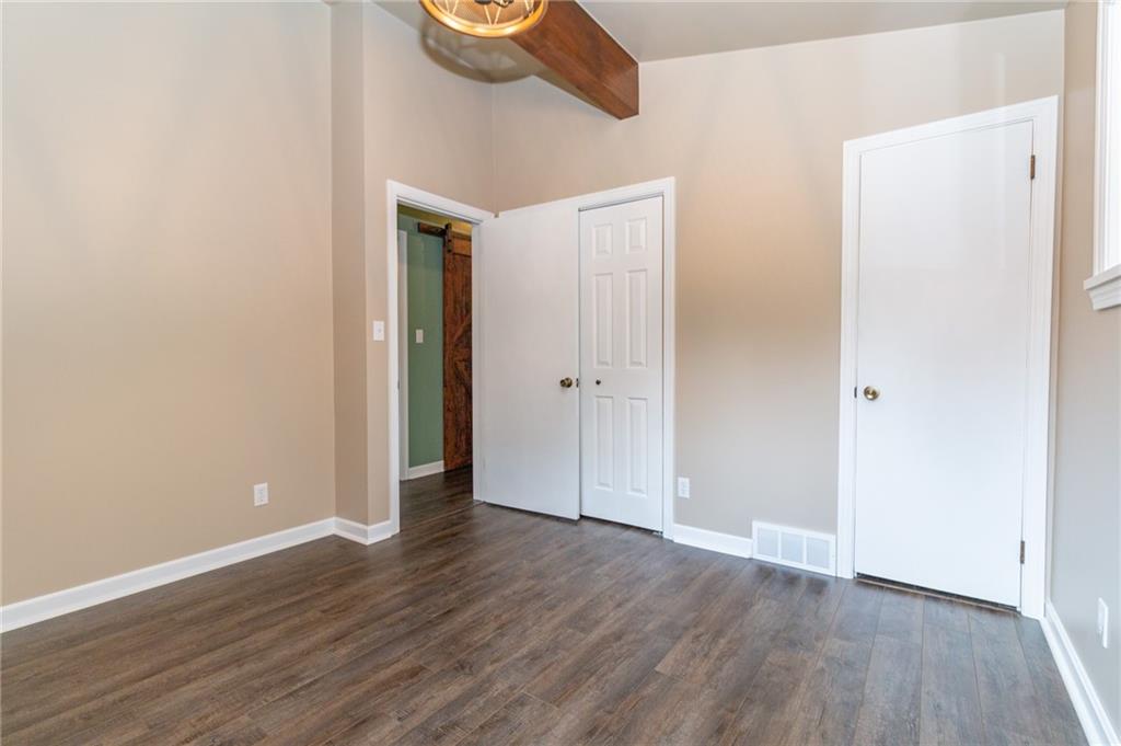 681 Bullcreek Road Butler, PA 16002 - Photo 19 of 39 a view of an empty room with wooden floor