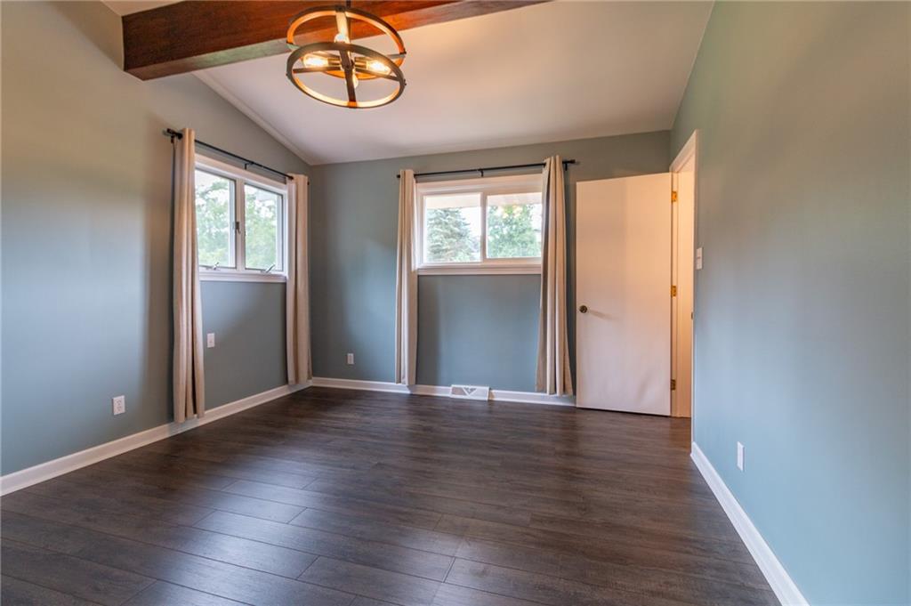 681 Bullcreek Road Butler, PA 16002 - Photo 21 of 39 an empty room with wooden floor and windows