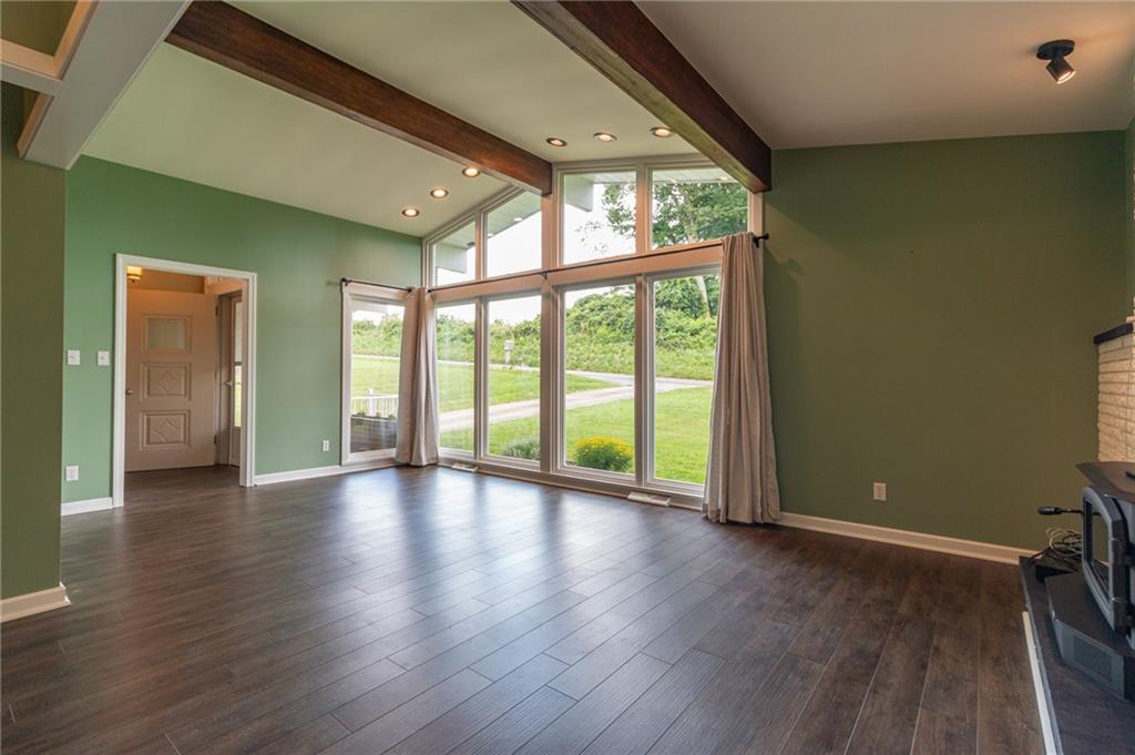 681 Bullcreek Road Butler, PA 16002 - Photo 4 of 39 an empty room with wooden floor and windows