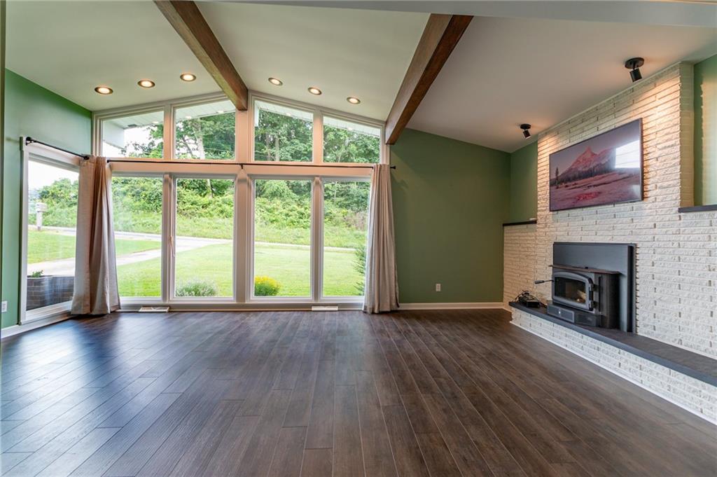 681 Bullcreek Road Butler, PA 16002 - Photo 5 of 39 a view of an empty room with wooden floor and a window