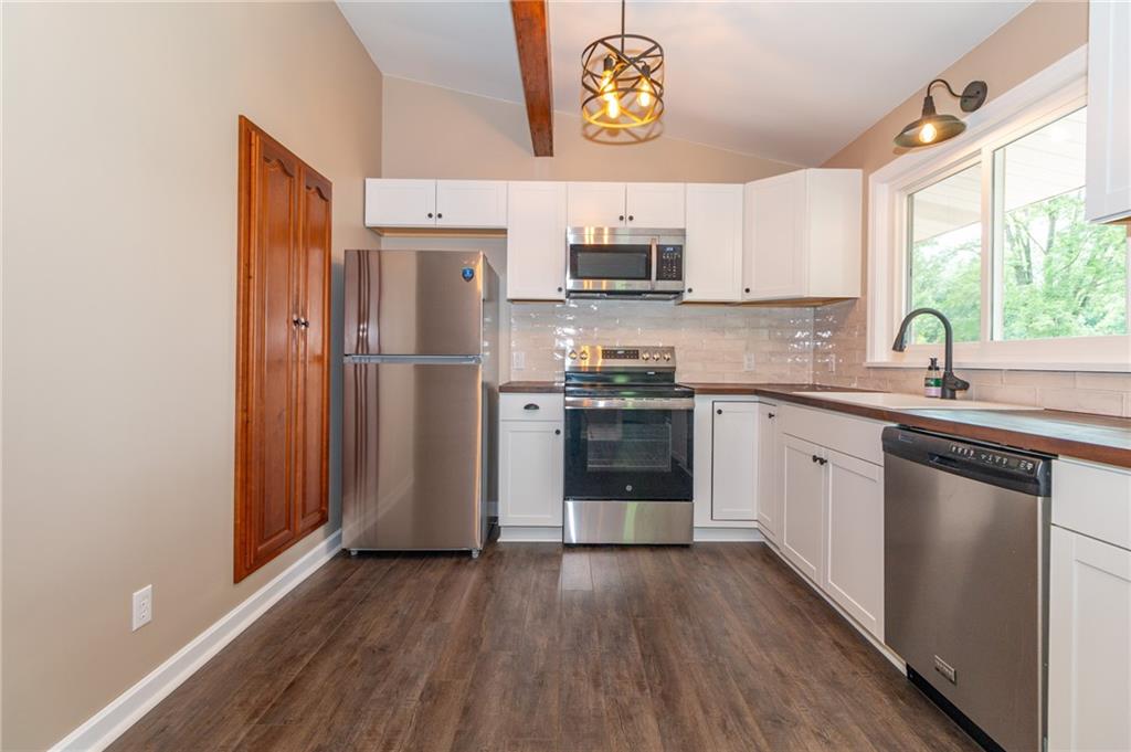681 Bullcreek Road Butler, PA 16002 - Photo 10 of 39 a kitchen with stainless steel appliances a sink cabinets and a window