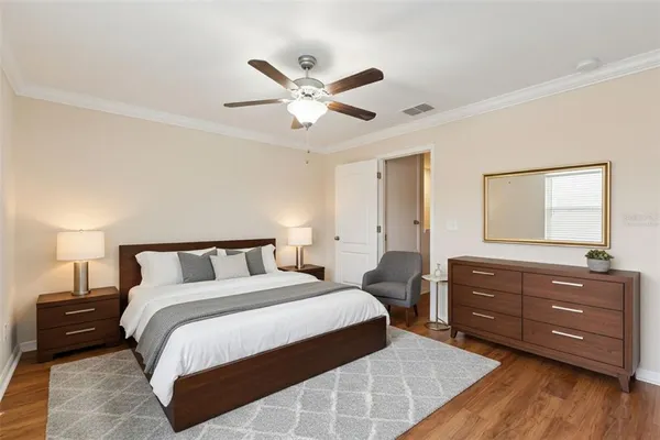 a bedroom with a bed and a dresser