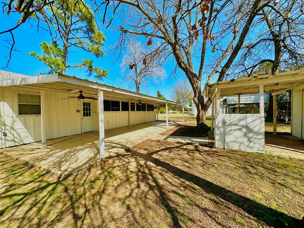 161 Elizabeth Street, Unit A Pottsboro, TX 75076 - Photo 20 of 20 a view of a house with a tree