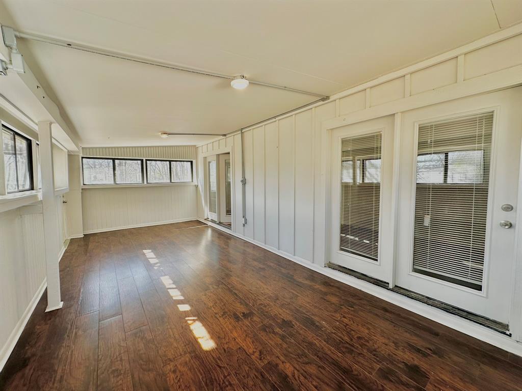 161 Elizabeth Street, Unit A Pottsboro, TX 75076 - Photo 2 of 20 wooden floor in an empty room with a window