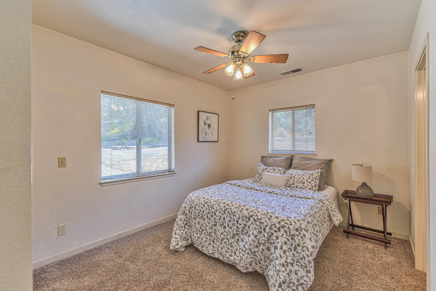 394 Mesa Road Salinas, CA 93908 - Photo 44 of 53 a bedroom with a bed and a chandelier