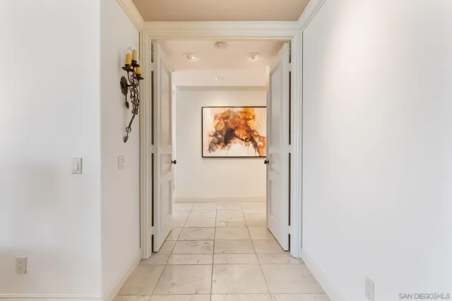 a view of a hallway with a outdoor space