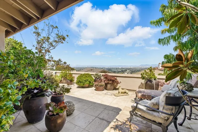 a view of a terrace with furniture and stove