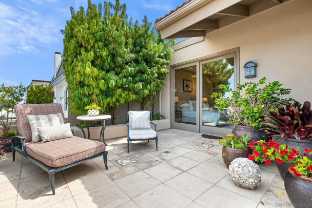 a view of a chairs and table in a patio