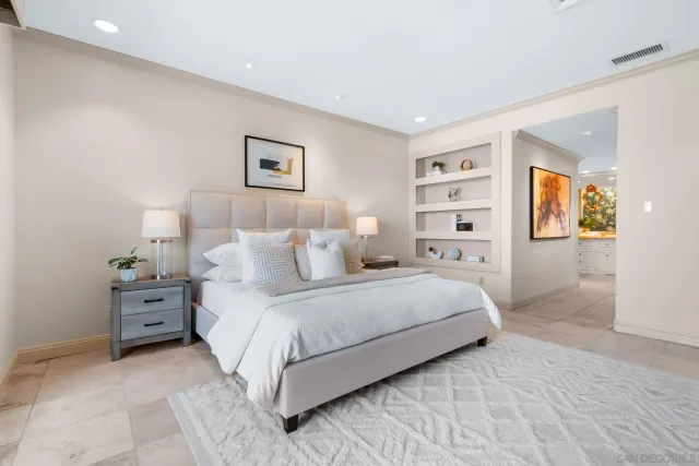 a bedroom with a bed and a couch