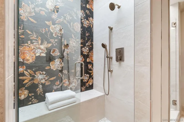 a bathroom with a bathtub and shower