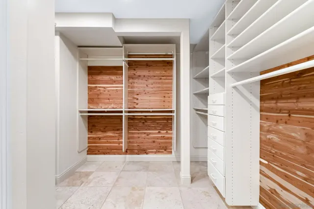 a view of closet area with empty racks