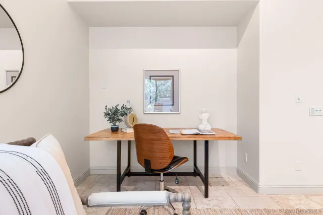 a workspace with furniture and a window