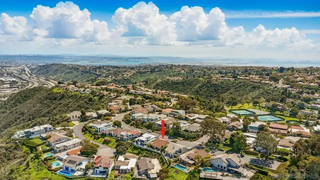 an aerial view of a residential houses with outdoor space