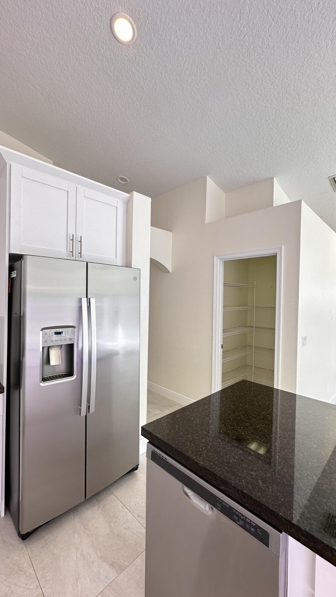 19010 Southwest 10th Street Pembroke Pines, FL 33029 - Photo 12 of 59 a kitchen with granite countertop a refrigerator and a sink