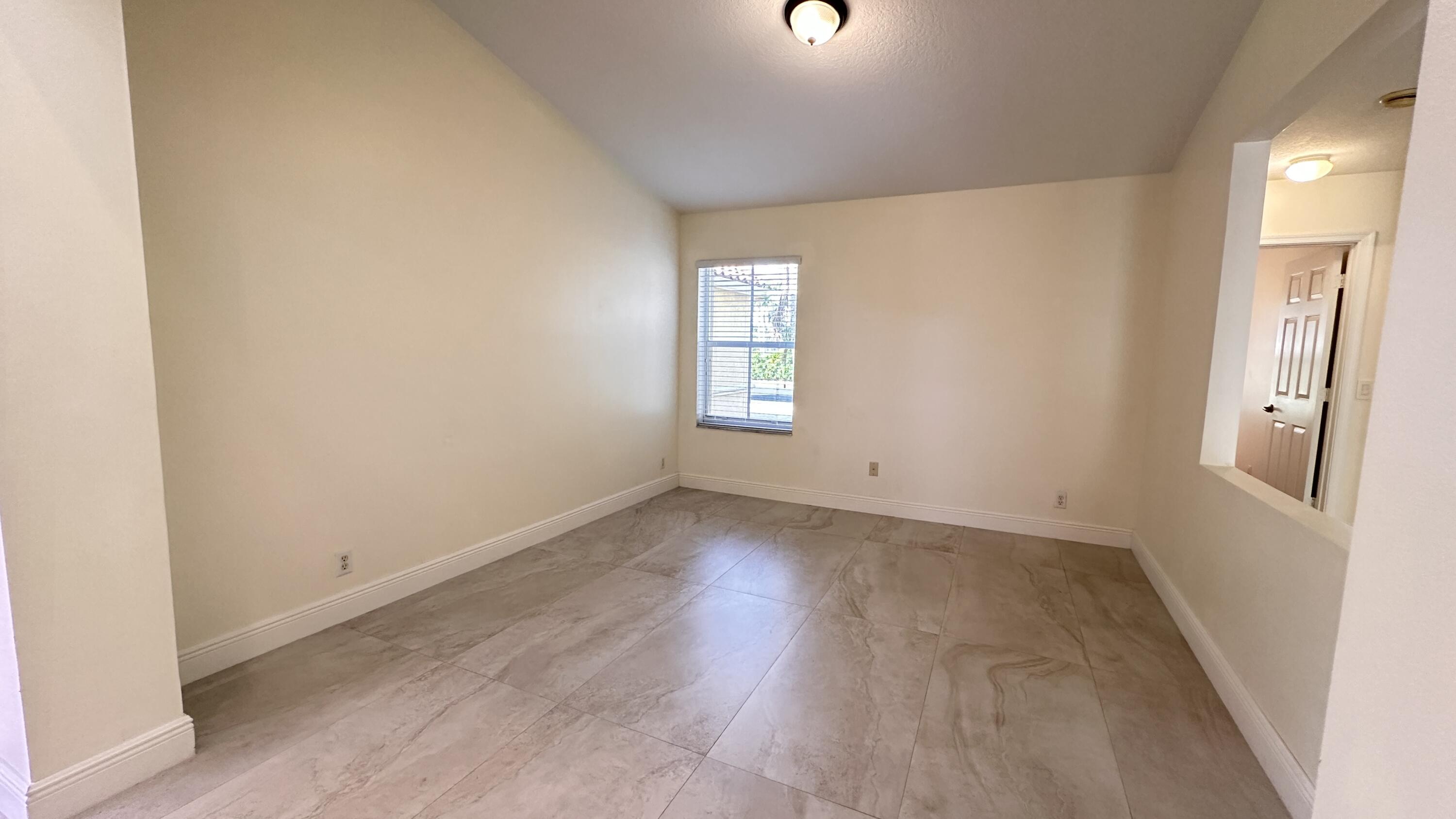 19010 Southwest 10th Street Pembroke Pines, FL 33029 - Photo 20 of 59 an empty room with wooden floor and window
