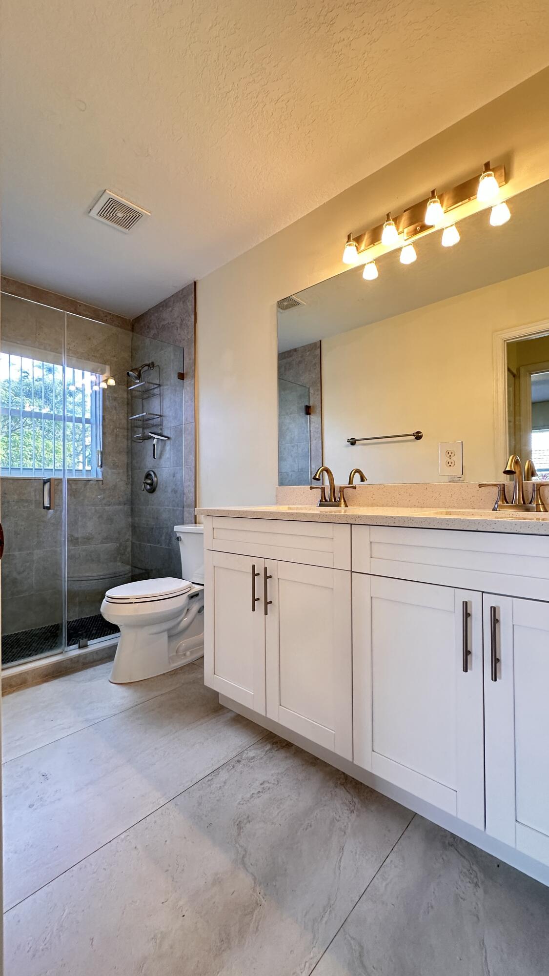 19010 Southwest 10th Street Pembroke Pines, FL 33029 - Photo 28 of 59 a spacious bathroom with a double vanity sink toilet mirror and bathtub