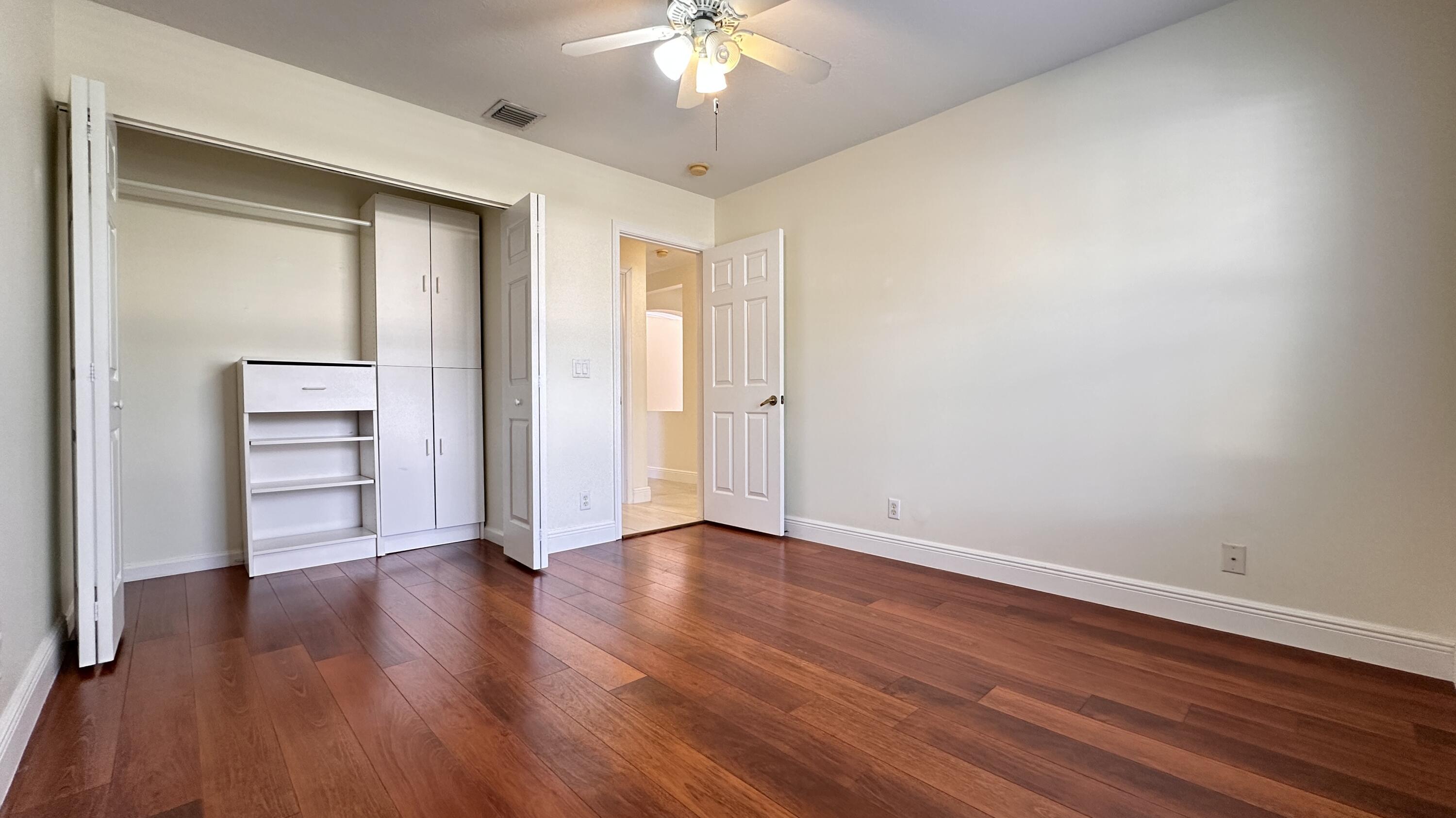 19010 Southwest 10th Street Pembroke Pines, FL 33029 - Photo 31 of 59 a view of an empty room with a window and wooden floor