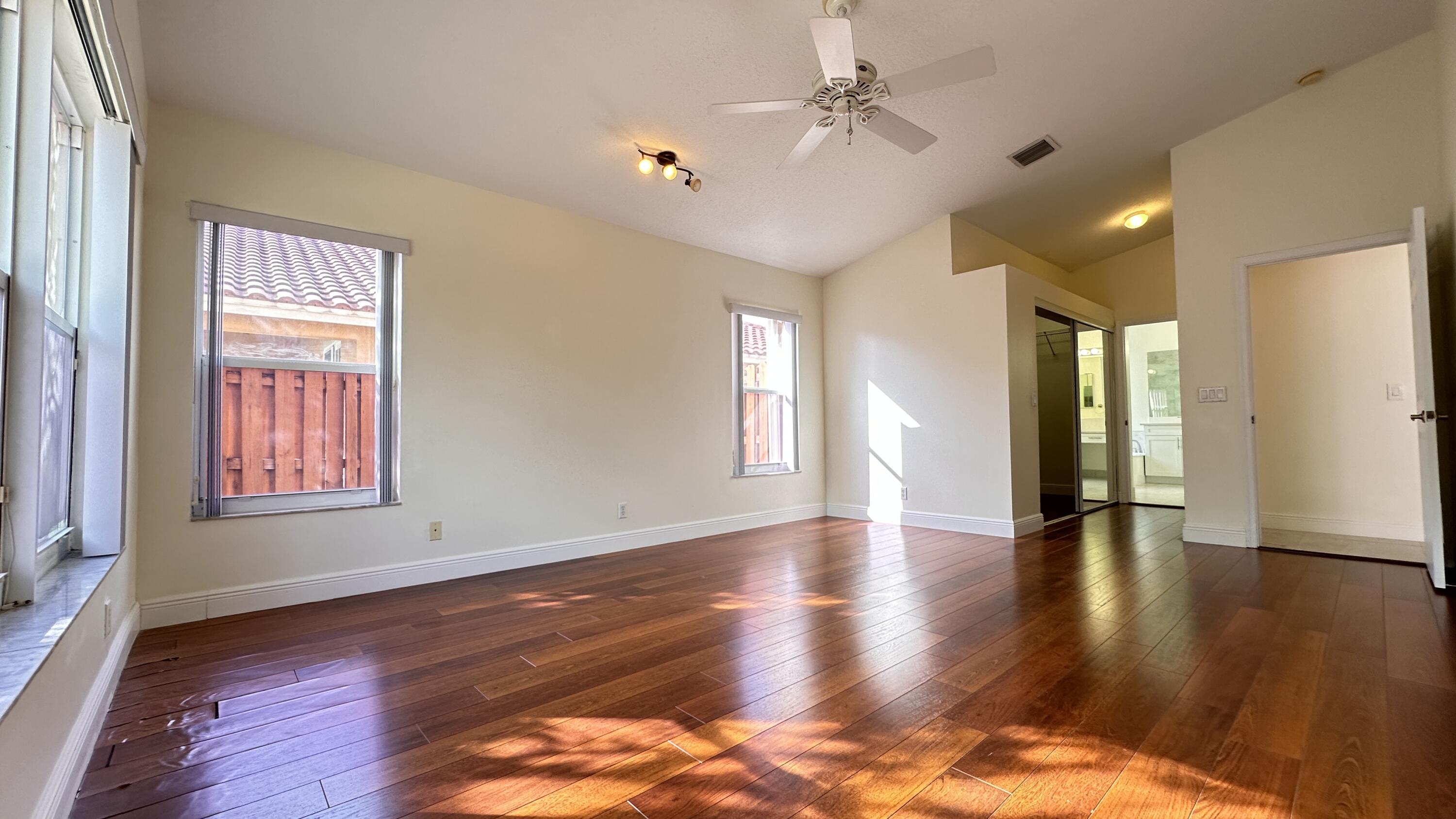 19010 Southwest 10th Street Pembroke Pines, FL 33029 - Photo 33 of 59 a view of an empty room with window and wooden floor