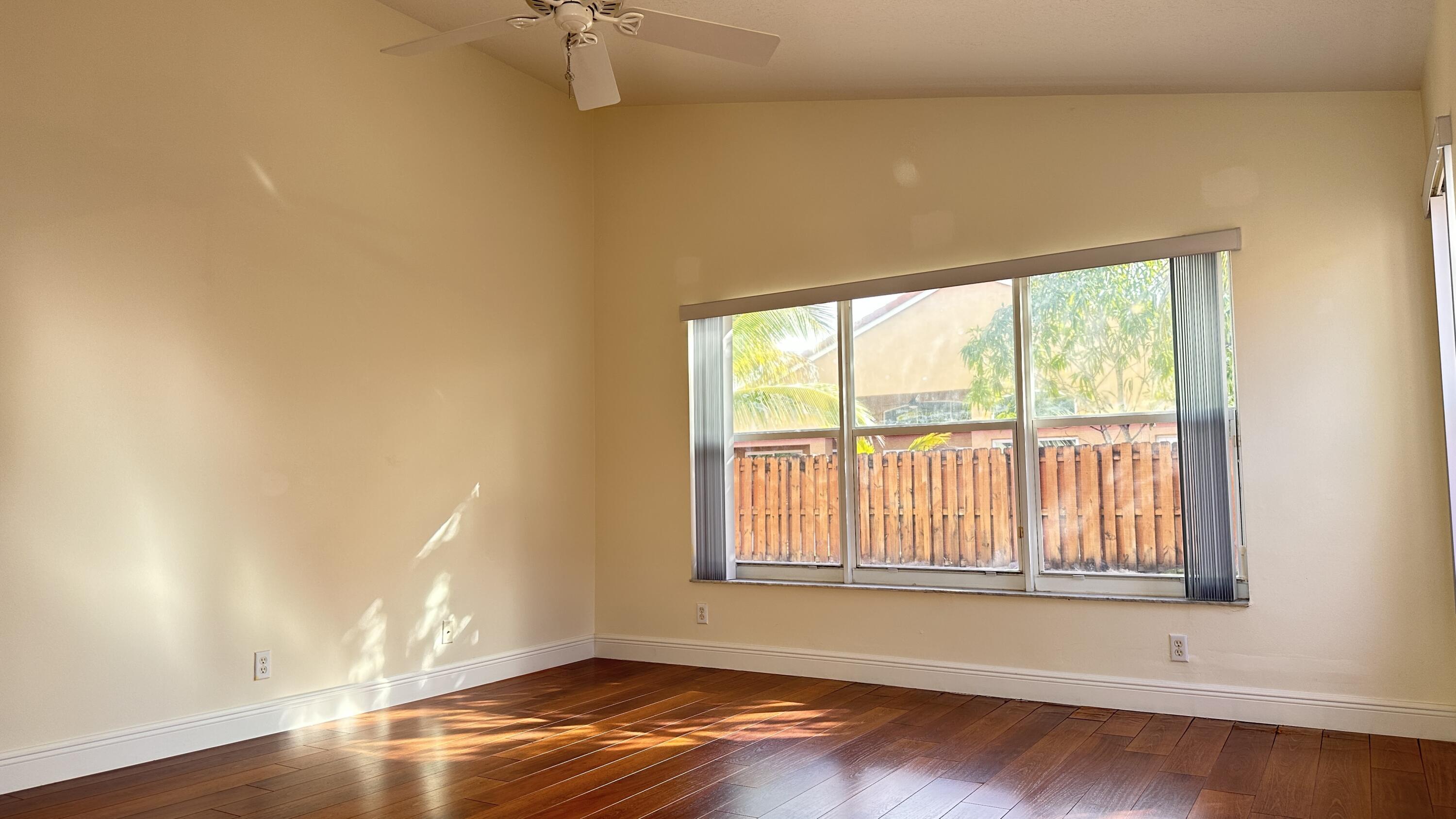 19010 Southwest 10th Street Pembroke Pines, FL 33029 - Photo 34 of 59 a view of empty room with wooden floor and fan